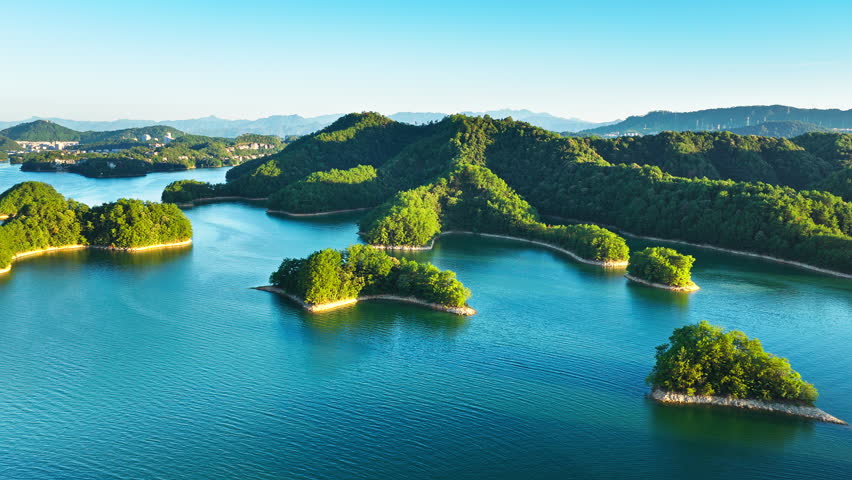Aerial view of the beautiful lake and green islands with mountain natural landscape in the morning. Famous Qiandao Lake scenery in Hangzhou.