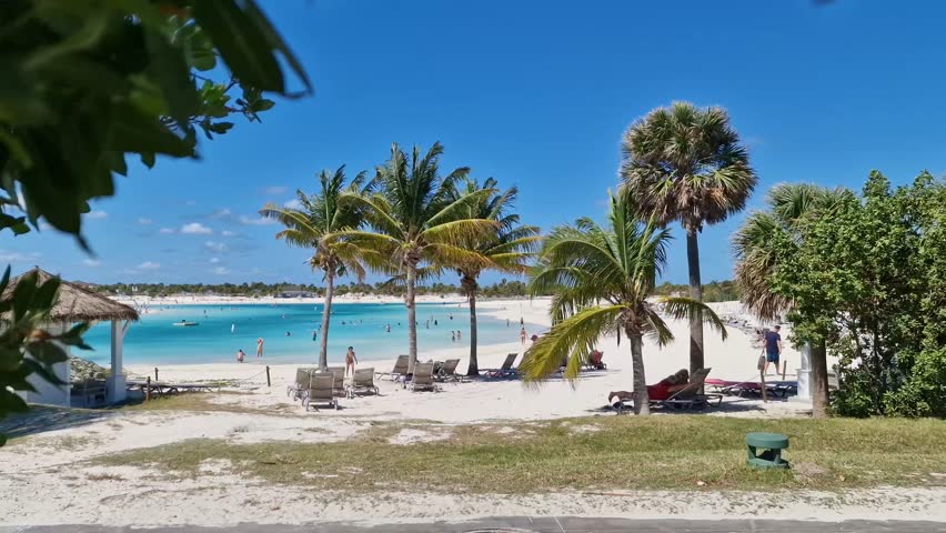 Relax on a stunning tropical beach in Ocean Cay, Bahamas. 
This 4K video captures the beauty of white sand, turquoise water, and clear blue sky — the perfect Caribbean paradise scene.