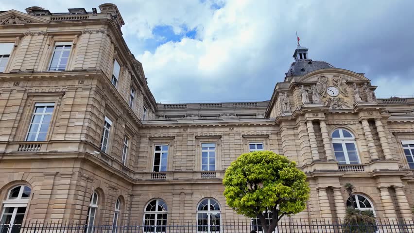 Front view of the Luxembourg Palace, Paris, France, showcasing historic architecture, royal heritage, and scenic urban surroundings in daylight.