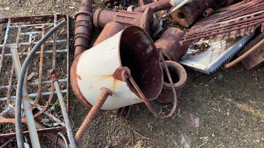 Rusty Scrap Metal Parts and Industrial Iron Wheels in Junkyard - Powered by Shutterstock - Get 15% off with code: PIKWIZARD15