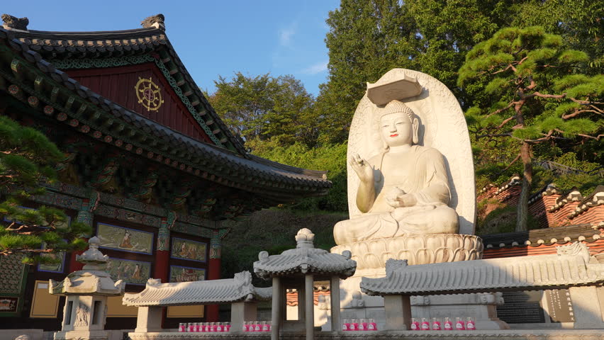 Serene Buddha Statue at a Korean Buddhist Temple in Sunset Light