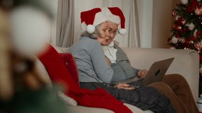 Happiness and joy in Christmas vacation, aged man and woman calling by video. Joyful aged spouses communicating online with family, congratulations and celebration, good emotions and positivity - Powered by Shutterstock - Get 15% off with code: PIKWIZARD15