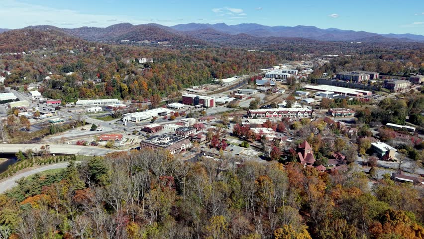 aerial push in biltmore village area of asheville nc, north carolina one year after hurricane helene