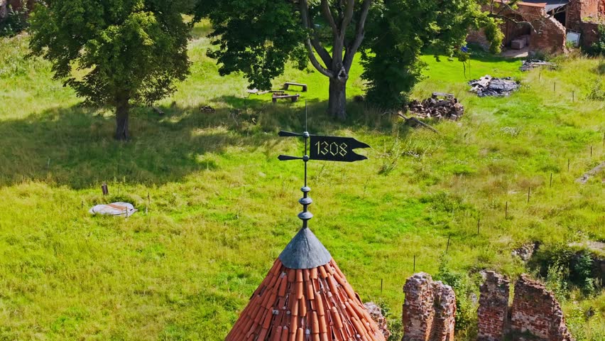 Historic Pomezania Castle ruins Szymbark aerial, medieval tower and weather vane