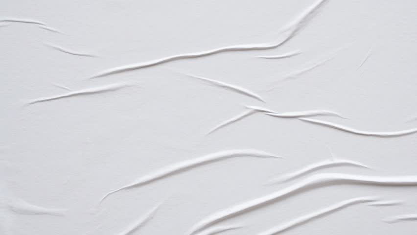 white crumpled and creased glued wrinkled paper poster texture background stop motion