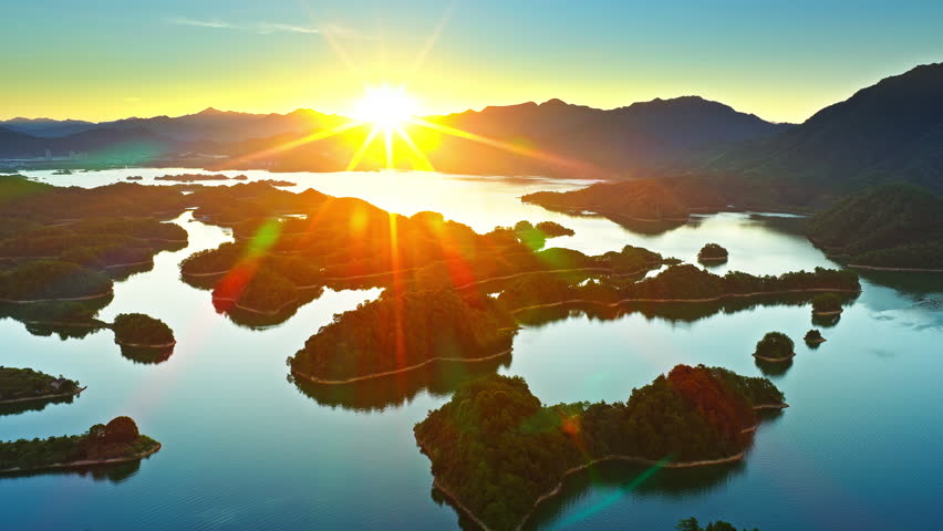 Aerial view of the beautiful lake and green islands with mountain natural landscape at sunrise. Famous Qiandao Lake scenery in Hangzhou.