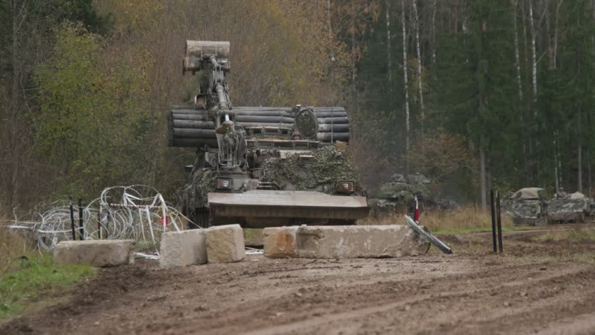 Tanks and specialized armored vehicles use a variety of attachments and methods to overcome battlefield obstacles such as minefields, anti-tank trenches, and physical barriers.