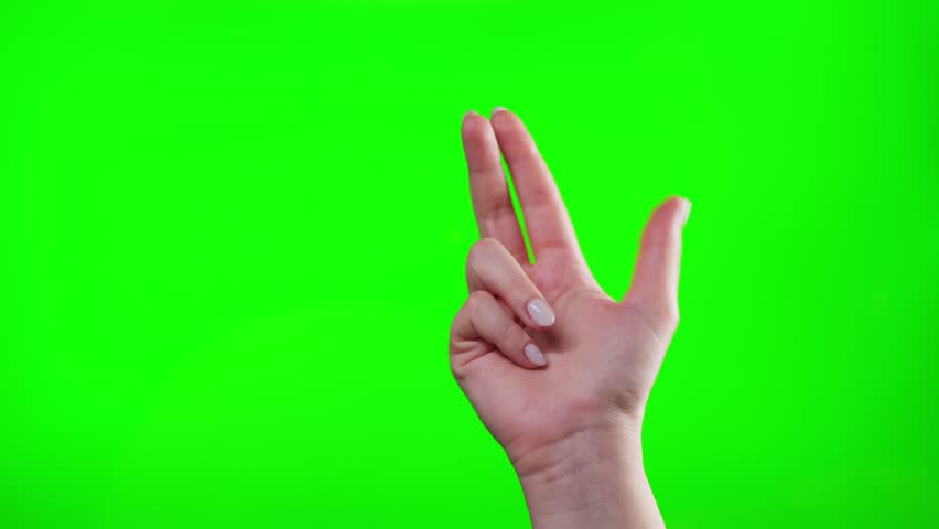 Hand gesture showing the number 3 on green screen chroma key background.