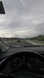 Driving on a Highway Under Overcast Skies Person Perspective - Powered by Shutterstock - Get 15% off with code: PIKWIZARD15