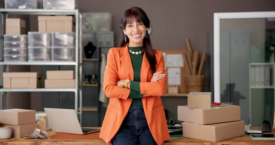 Face, ecommerce and arms crossed with business woman in warehouse for shipping, fashion retail and about us. Designer startup, clothing entrepreneur and supply chain with person in creative factory