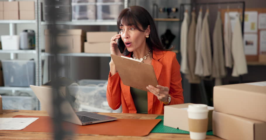 Small business, phone call and woman with paperwork for stress, mistake and delivery delay. Startup, fashion and frustrated person on laptop, smartphone and talking for logistics, shipping and crisis