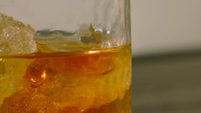 Slow Pan Across Whiskey in Tumbler with Fresh Cold Ice Cubes. Refreshing Alcoholic Drink. - Powered by Shutterstock - Get 15% off with code: PIKWIZARD15