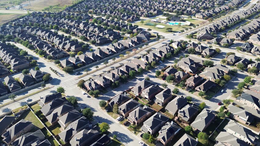 Master-planned Castle Hills neighborhood with clubhouse, tennis courts, pool, cul-de-sac, fenced yards. Vacant land background signals future residential or mixed-use development, Lewisville, TX. USA