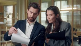 Multiracial office business workers speaking paperwork contract financial deal at office Caucasian businessman Korean businesswoman discuss chart lawyers documents agreement checking report indoors - Powered by Shutterstock - Get 15% off with code: PIKWIZARD15