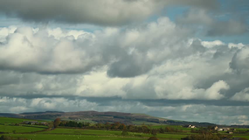 Cumulonimbus And Nimbus Clouds Forming Over Lush English Countryside. Time Lapse 60x Normal Speed.