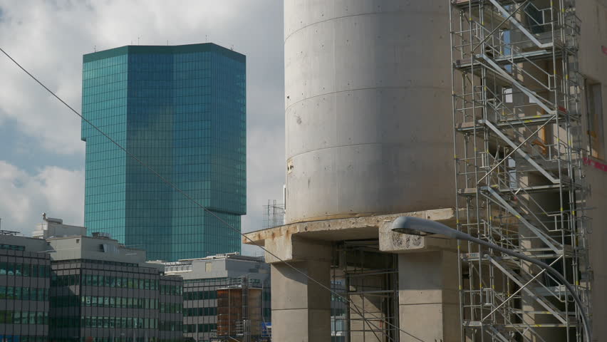 sunny day blue sky zurich city construction yard modern office building exterior slow motion panorama 4k switzerland