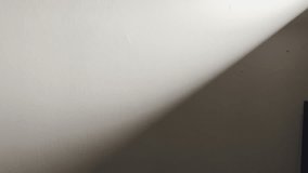 Minimal wall texture with a diagonal shadow slowly moving closer. Calm, modern, abstract backdrop ideal for fashion, architecture, meditation, branding, or atmospheric visuals. - Powered by Shutterstock - Get 15% off with code: PIKWIZARD15
