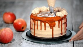 Decorating Caramel Apple Cake with Cream and Drizzle - Powered by Shutterstock - Get 15% off with code: PIKWIZARD15