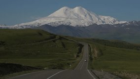 Epic Mountain Scenic Road Leading to Snowy Elbrus Peak Vertical video - Powered by Shutterstock - Get 15% off with code: PIKWIZARD15