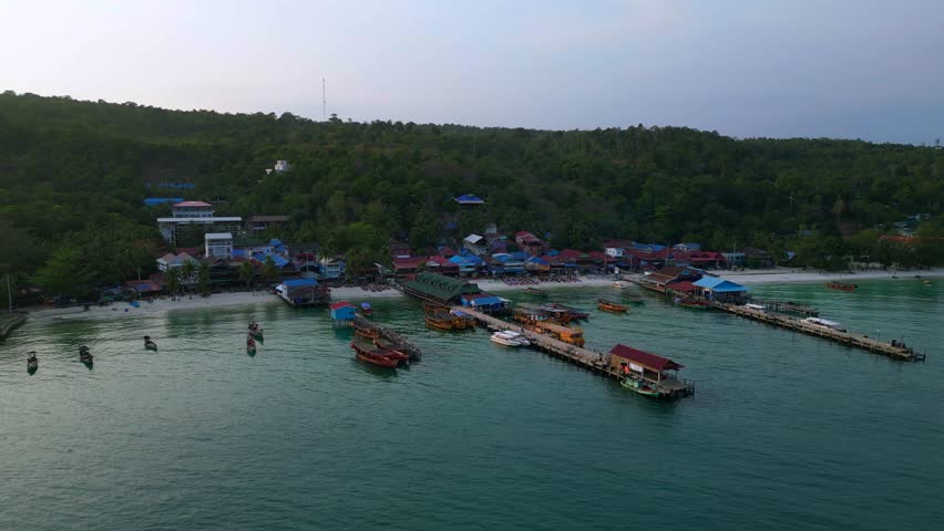 Koh Rong fishing village with boats evening. Marvelous aerial view flight drone