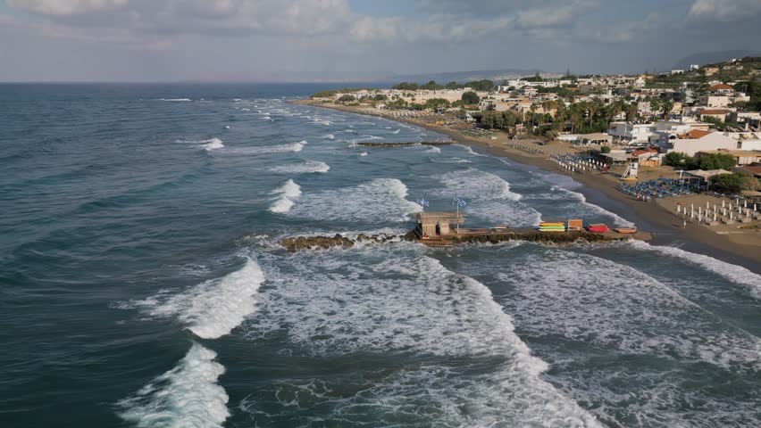 Aerial, panoramic view of the northern coast of the island of Crete near the town of Agia Marina and Platanias, Crete, Greece