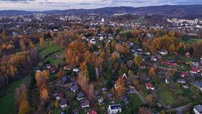 sunset perspective showcasing lively street scenes surrounded by fall leaves and distant urban - Powered by Shutterstock - Get 15% off with code: PIKWIZARD15