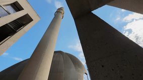 Minaret of the mosque in Cologne with the two golden rings against blue sky - Powered by Shutterstock - Get 15% off with code: PIKWIZARD15