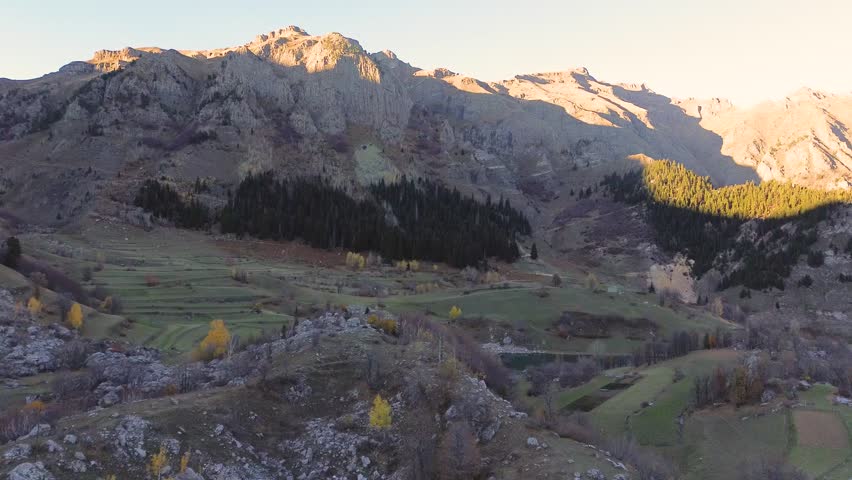 Beautiful autumn view of Şavşat, Artvin, Turkey. The lake is surrounded by colorful trees and mountains, offering a peaceful and scenic nature experience.