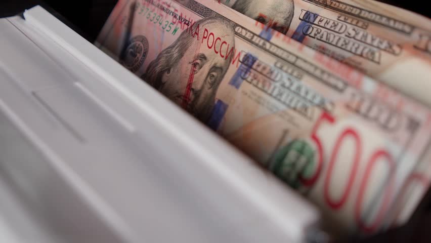 Double-exposure video of US dollar and Russian ruble banknotes in a counting machine, symbolizing global finance, currency exchange, economic power, and international money flow - Powered by Shutterstock - Get 15% off with code: PIKWIZARD15