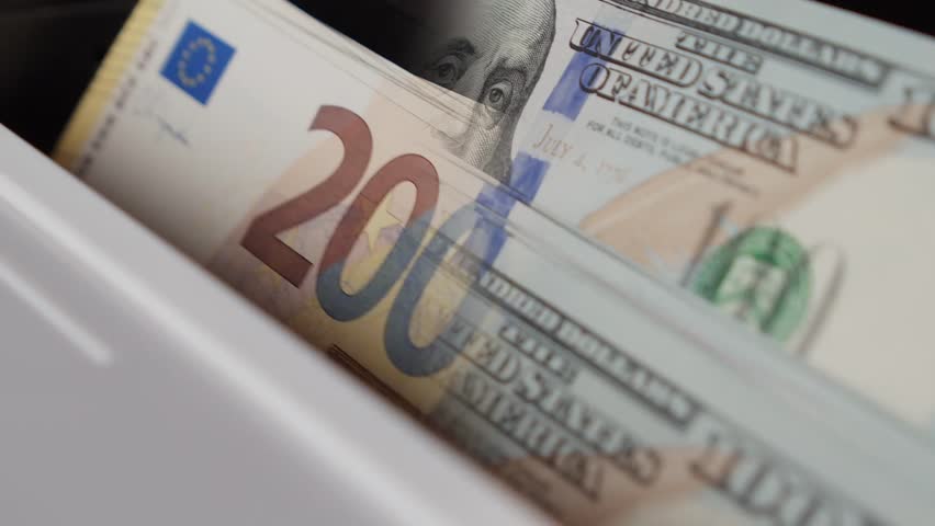 Double-exposure video of US dollar and Euro banknotes in a counting machine, symbolizing global finance, currency exchange, economic power, and international money flow - Powered by Shutterstock - Get 15% off with code: PIKWIZARD15