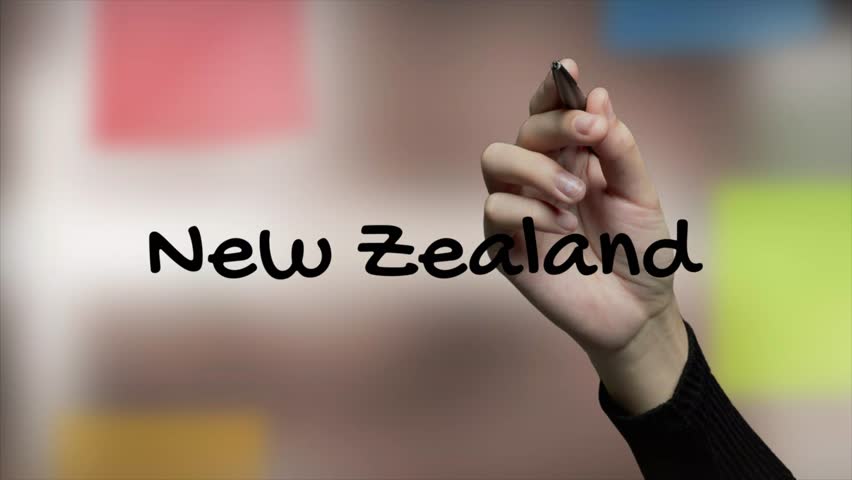 New Zealand Black Marker Writing on Glass Surface