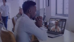 Man watching live call on laptop during business meeting, HUD overlay updating charts on screen. Office, openplan, workspace, conference, virtual, futuristic, daylight - Powered by Shutterstock - Get 15% off with code: PIKWIZARD15