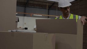 Warehouse packer inspecting box, grabbing tape dispenser, sealing for shipping, HUD tracking hands. Packaging, fulfillment, logistics, warehouse, worker, hardhat, highvis - Powered by Shutterstock - Get 15% off with code: PIKWIZARD15