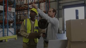 Lead pointing scanner, worker donning helmet checking clipboard as data overlays swelling for stock. Warehouse, inventory, teamwork, barcode, analytics, industrial, efficiency - Powered by Shutterstock - Get 15% off with code: PIKWIZARD15