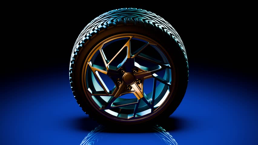 A single upright wheel rotates calmly on a blue-lit studio surface, with metallic spokes and rubber tread reflecting soft highlights while the steady loop provides clean automotive motion 