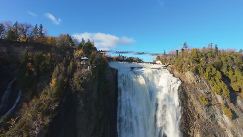 Macro cinematic view of falling water texture and details with sparkling light.