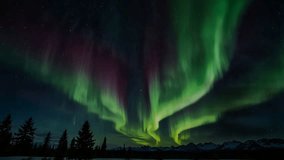 The spectacular sight of the Aurora Borealis (Northern Lights), with a curtain of predominantly green light and touches of pink or purple sweeping across the dark, star-studded night sky. - Powered by Shutterstock - Get 15% off with code: PIKWIZARD15