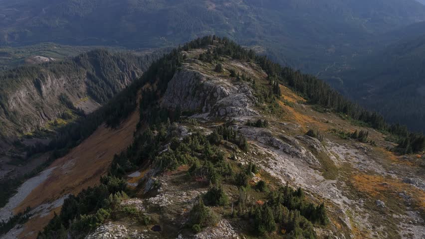 Majestic Aerial View of a Mountain Ridge and Forest Landscape in British Columbia, Canada