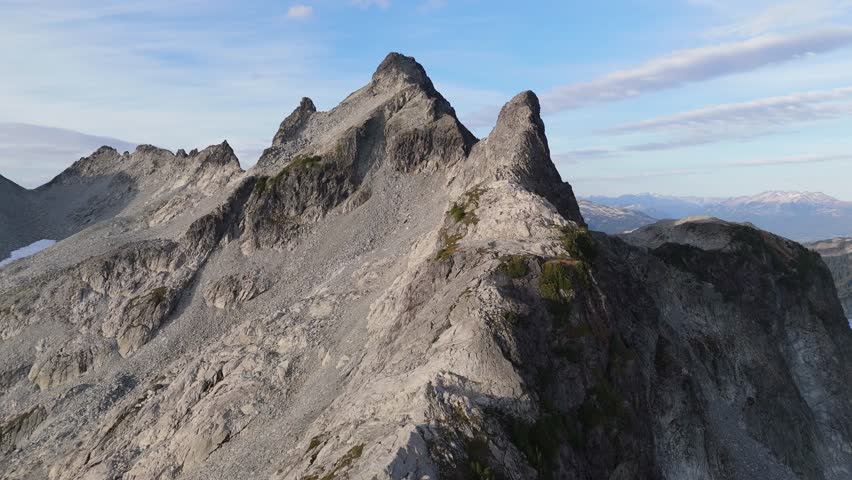 Majestic Rocky Mountain Peaks Dominating the British Columbia Landscape in Canada Under a Clear Blue Sky