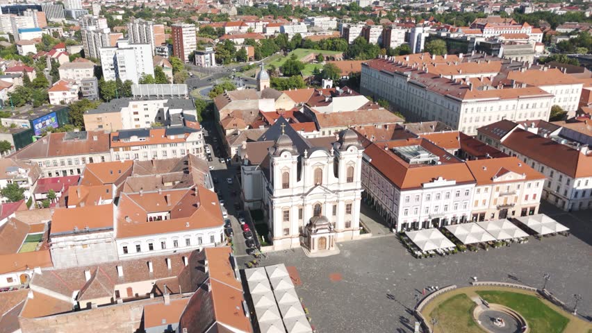 Aerial of Saint George’s Catholic Cathedral in Timisoara, Romania, showcasing its baroque architecture and prominent position in Union Square.