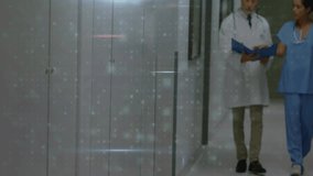 Doctor and nurse walking hospital hall while grid overlay showing malware detection numbers pulsing. Medical, technology, cybersecurity, digital, healthcare, data, analysis - Powered by Shutterstock - Get 15% off with code: PIKWIZARD15