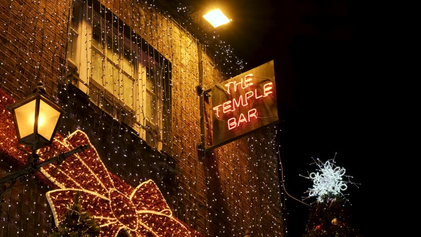 Christmas lights and red facade of the Temple Bar in Dublin