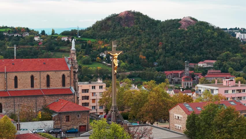 Aerial shot around the Colline des Peres in Saint Etienne city with Saint Mary