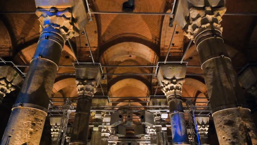 Interior view of the Theodosius Cistern in Istanbul, Turkey, featuring rows of columns, twilight ambiance, and historic Byzantine architecture.