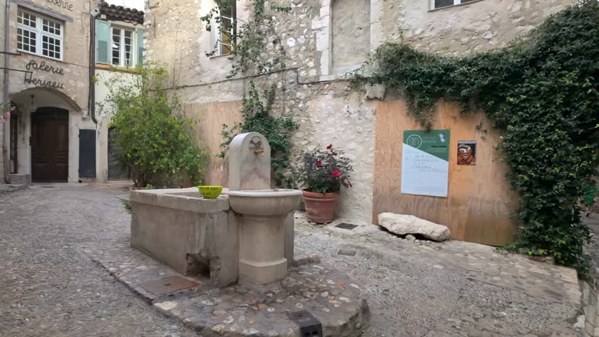 Close-up of a drinking water fountain in Saint-Paul-de-Vence, France, highlighting charming village details, public amenities, and everyday life.