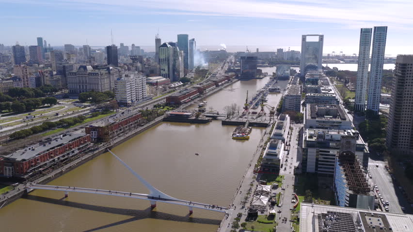 Drone aerial view of Puerto Madero canal and skyscrapers in Buenos Aires Argentina.