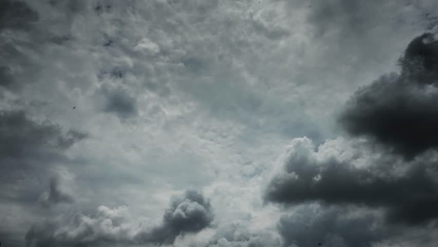 Dramatic dark storm clouds gathering in overcast sky, perfect for weather-related content and atmospheric backgrounds with moody lighting effects.