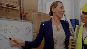 Supervisor pointing board and starting network overlay connecting tablet, team planning logistics. Warehouse, collaboration, safety, diagram, flow, data, pallets - Powered by Shutterstock - Get 15% off with code: PIKWIZARD15