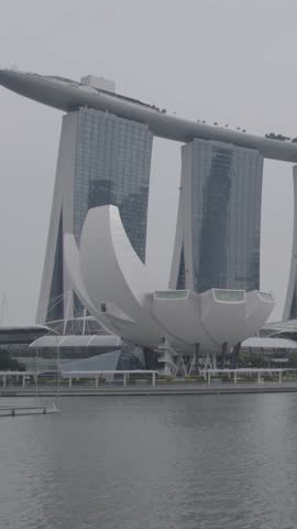 Iconic Marina Bay Sands in cloudy Singapore, urban skyline mood