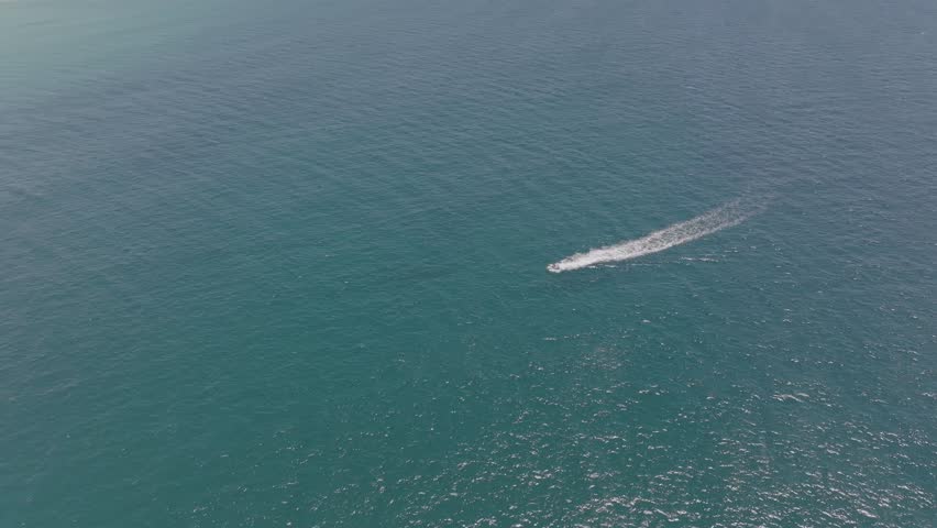 Elevated view of jet ski between Cook Island and Fingal Head causeway, northern New South Wales, Australia